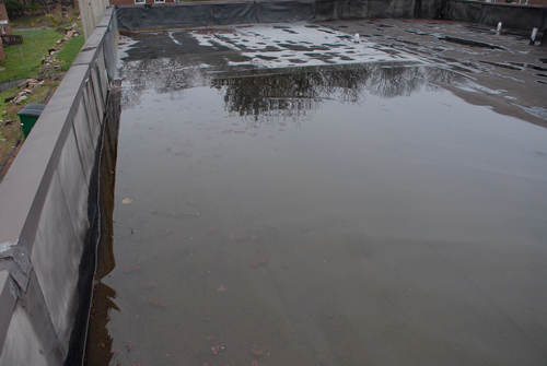 Water pooling on a commercial roof, drains are not working