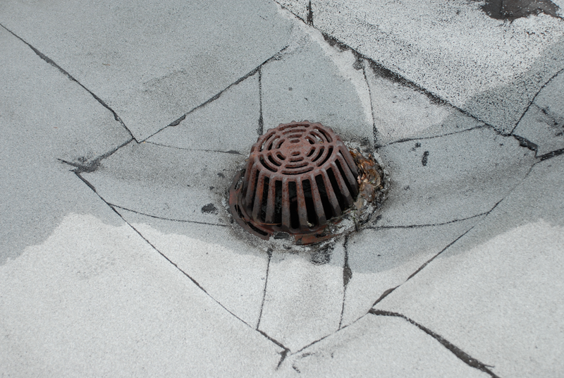 A recessed area around a drain to collect debris