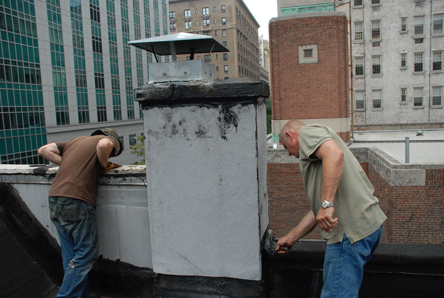 Chimney has been sealed with white ceramic granules embedded in the Modified Bitumen Rubber membrane.