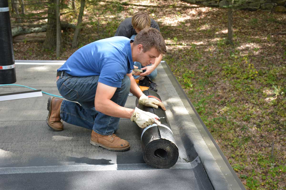 Sven Ferreira - installing Two Ply Rubber Roof System