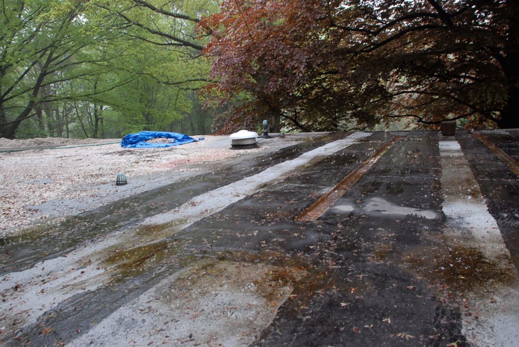 Preparing the surface for installing a new rubber roof. Use leave blower Preparing the surface for installing a new rubber roof. Use leave blower