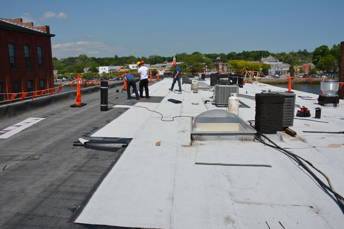 In the process of Installing a Two Ply Rubber Roof over a gravel Rock roof In the process of Installing a Two Ply Rubber Roof over a gravel Rock roof