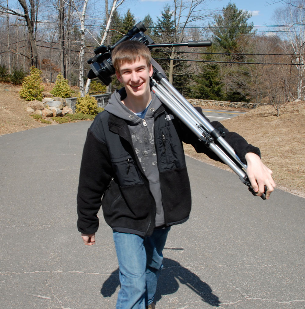 Erik carrying the cameras for video shooting on a roof Erik carrying the cameras for video shooting on a roof