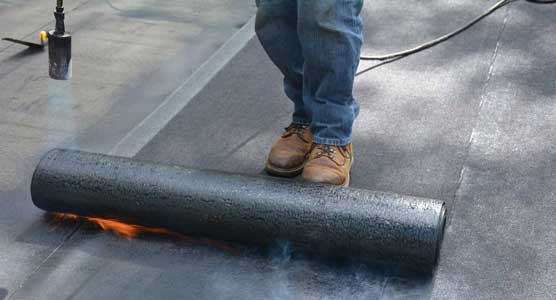 Torching down or heat fusing a Modified Bitumen Rubber Membrane