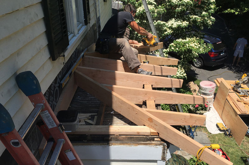 Andre ferreira doing carpentry work on roof